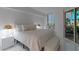 Bright bedroom with stylish decor and a view of the bustling city through the window at 2857 Paradise Rd # 305, Las Vegas, NV 89109