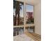 Inviting bedroom view features pool and cityscape through a large window for a luxury resort style at 2857 Paradise Rd # 305, Las Vegas, NV 89109