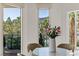 Bright dining area with views of the city, Encore hotel, and palm trees at 2857 Paradise Rd # 305, Las Vegas, NV 89109