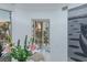Close up of a dining table with flowers and greenery, with a palm tree view at 2857 Paradise Rd # 305, Las Vegas, NV 89109