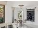 Dining area featuring a glass table and modern chairs, with views of the outdoor terrace and stylish decor at 2857 Paradise Rd # 305, Las Vegas, NV 89109