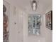 Elegant hallway with sleek tile floors, modern art, and a view into the living room at 2857 Paradise Rd # 305, Las Vegas, NV 89109