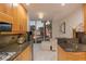 Cozy kitchen featuring granite countertops, wooden cabinets, and a scenic window view at 2857 Paradise Rd # 305, Las Vegas, NV 89109