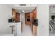 Modern kitchen boasts wood cabinetry, black countertops, and stainless steel appliances at 2857 Paradise Rd # 305, Las Vegas, NV 89109