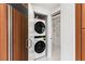 Convenient laundry closet with stacked washer and dryer, located adjacent to the kitchen at 2857 Paradise Rd # 305, Las Vegas, NV 89109