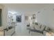 Spacious living and dining area with comfortable seating, art decor, and views of palm trees through large windows at 2857 Paradise Rd # 305, Las Vegas, NV 89109