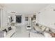 Bright living room boasts white tile flooring, modern decor, and lots of space at 2857 Paradise Rd # 305, Las Vegas, NV 89109