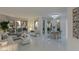 Open-concept living space with sleek tile flooring, modern furnishings, and abundant natural light at 2857 Paradise Rd # 305, Las Vegas, NV 89109