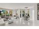 Open living space with floor-to-ceiling windows, access to an outdoor patio, and a stylish dining set at 2857 Paradise Rd # 305, Las Vegas, NV 89109