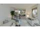 Stylish living room with elegant sofas, modern decor and views of palm trees from the sliding glass doors at 2857 Paradise Rd # 305, Las Vegas, NV 89109