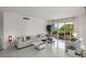Bright living room with access to a terrace, featuring contemporary sofas, neutral decor, and ample natural light at 2857 Paradise Rd # 305, Las Vegas, NV 89109