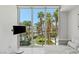 Living room with views of the pool, palm trees, and luxury resort at 2857 Paradise Rd # 305, Las Vegas, NV 89109