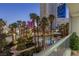 Balcony view of the pool and lush landscaping, offering a serene outdoor retreat at 2857 Paradise Rd # 305, Las Vegas, NV 89109