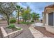 Backyard featuring lush landscaping and stone walkways at 3104 Archwood Way, Las Vegas, NV 89134
