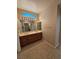 Bathroom with dual sinks, tile flooring and neutral wallpaper at 3104 Archwood Way, Las Vegas, NV 89134