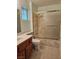 Bathroom featuring tile flooring, marble shower, and wood vanity at 3104 Archwood Way, Las Vegas, NV 89134