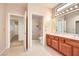 Bathroom featuring a double sink vanity, tiled floor, and walk-in shower at 3104 Archwood Way, Las Vegas, NV 89134