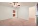 Bedroom with ceiling fan, carpeted floor, and access to ensuite bath and walk-in closet at 3104 Archwood Way, Las Vegas, NV 89134