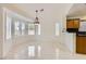 Bright dining room featuring tile flooring, natural light, and a decorative chandelier at 3104 Archwood Way, Las Vegas, NV 89134