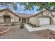 Well-maintained single-story home featuring desert landscaping, stone accents, and a two-car garage at 3104 Archwood Way, Las Vegas, NV 89134