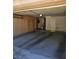Well-organized garage featuring custom cabinetry and concrete flooring at 3104 Archwood Way, Las Vegas, NV 89134