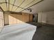 Spacious garage featuring ample cabinet storage and an automatic door opener at 3104 Archwood Way, Las Vegas, NV 89134