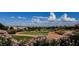 Picturesque golf course view with pink flowers in the foreground and city view background at 3104 Archwood Way, Las Vegas, NV 89134
