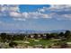 Scenic golf course with city view and sand traps under a blue sky with white clouds at 3104 Archwood Way, Las Vegas, NV 89134