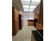 Spacious kitchen with wood cabinets, black appliances, and an island counter at 3104 Archwood Way, Las Vegas, NV 89134