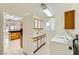 Bright laundry room with tiled floor and modern washer and dryer at 3104 Archwood Way, Las Vegas, NV 89134