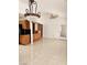 Open-concept room with vaulted ceiling, tile flooring, and door to the back at 3104 Archwood Way, Las Vegas, NV 89134