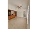 Bright living space features tile flooring, a built-in wall unit, and exterior door at 3104 Archwood Way, Las Vegas, NV 89134