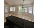 Bright living space featuring tile flooring, white walls, and large windows at 3104 Archwood Way, Las Vegas, NV 89134