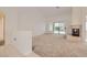Open-concept living room boasting a fireplace, sliding glass doors, and ample space for entertaining at 3104 Archwood Way, Las Vegas, NV 89134