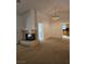 Open living area with a fireplace and views into the kitchen at 3104 Archwood Way, Las Vegas, NV 89134