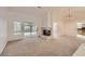 Bright living room with a cozy fireplace, sliding glass doors, and views of the backyard at 3104 Archwood Way, Las Vegas, NV 89134