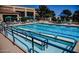 Resort-style pool with lounge chairs and sun umbrellas offers a relaxing outdoor experience at 3104 Archwood Way, Las Vegas, NV 89134