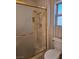 Bathroom shower with glass door and gold trim at 3104 Archwood Way, Las Vegas, NV 89134