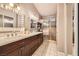 Bathroom features dual sinks and walk-in shower at 314 Abbington St, Henderson, NV 89074