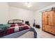 Bedroom featuring natural light, tile floors, and a closet at 314 Abbington St, Henderson, NV 89074