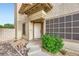 Inviting home entrance with manicured landscaping and neutral accents at 314 Abbington St, Henderson, NV 89074