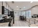 Well-lit kitchen features stainless steel appliances, light wood flooring, and granite countertops at 314 Abbington St, Henderson, NV 89074