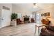 Bright living room featuring neutral walls, ceiling fan, and sliding door access at 314 Abbington St, Henderson, NV 89074