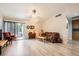 Bright living room featuring neutral walls, ceiling fan, and sliding door access at 314 Abbington St, Henderson, NV 89074