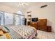 Bright bedroom with ensuite bathroom and patio access at 314 Abbington St, Henderson, NV 89074