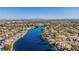 Aerial view of community with waterfront homes lining the canal with the city skyline on the horizon at 3151 Soaring Gulls Dr # 2136, Las Vegas, NV 89128