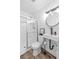 Modern bathroom with glass shower, laminate floors and floating sink at 3151 Soaring Gulls Dr # 2136, Las Vegas, NV 89128