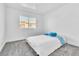 Bedroom with a full bed, neutral carpet and a view through the window at 3151 Soaring Gulls Dr # 2136, Las Vegas, NV 89128
