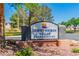 Community sign of Desert Shores Villas Condominiums with desert themed logo and landscaping at 3151 Soaring Gulls Dr # 2136, Las Vegas, NV 89128