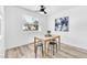 Bright dining area showcasing a wood table, black stools, and a window offering natural light at 3151 Soaring Gulls Dr # 2136, Las Vegas, NV 89128